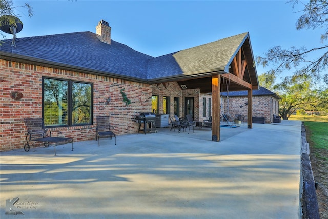 back of house with a patio area