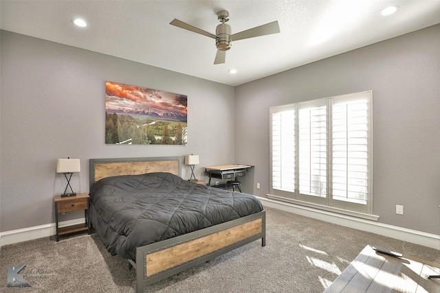 bedroom with ceiling fan and carpet