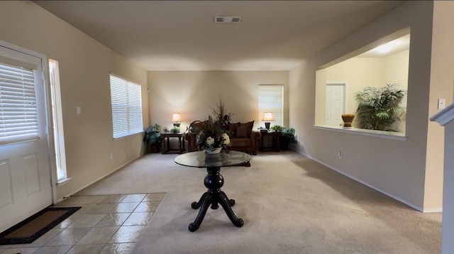 view of carpeted entrance foyer