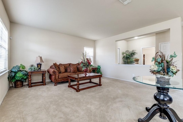 carpeted living room featuring visible vents