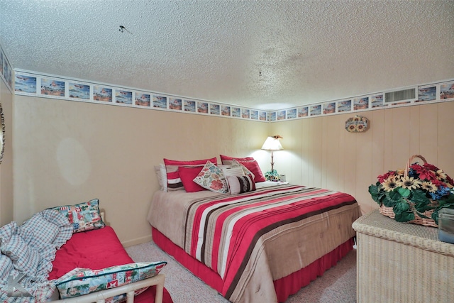 carpeted bedroom with a textured ceiling