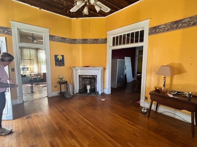 living room with dark hardwood / wood-style flooring