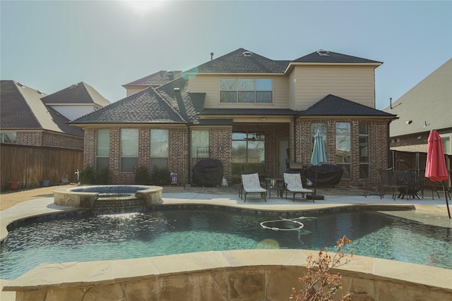 804 Colby Dr, Mansfield, TX 76063 - back of house with a patio area, a fenced backyard, brick siding, a pool with connected hot tub, and a shingled roof