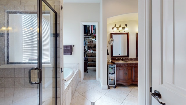 bathroom featuring vanity, separate shower and tub, and tile patterned floors