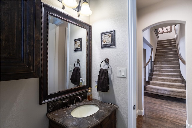 bathroom featuring vanity and wood-type flooring