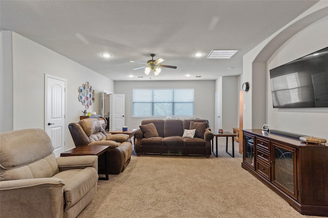 living room with ceiling fan and light carpet