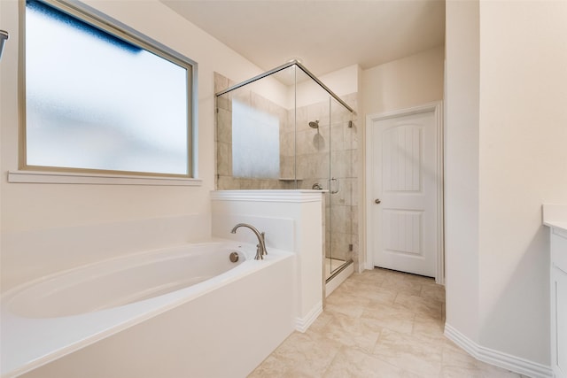 full bath with baseboards, a garden tub, vanity, and a shower stall