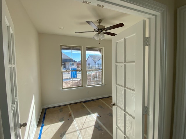 empty room featuring ceiling fan