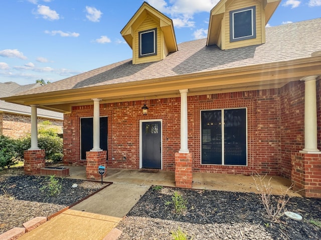 doorway to property with a porch