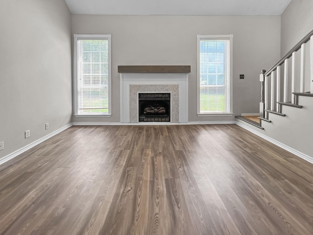 unfurnished living room featuring dark hardwood / wood-style flooring