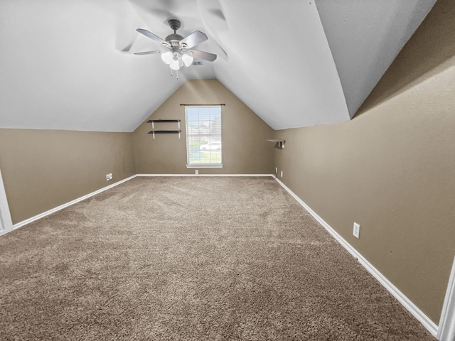 bonus room featuring ceiling fan, carpet floors, and vaulted ceiling