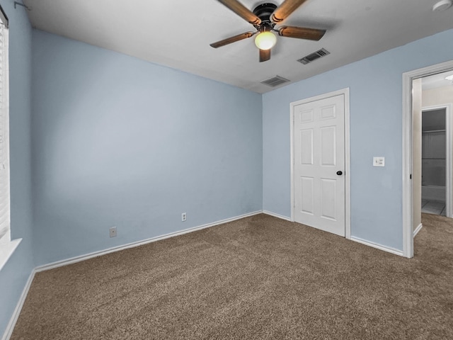 unfurnished bedroom with carpet floors and ceiling fan