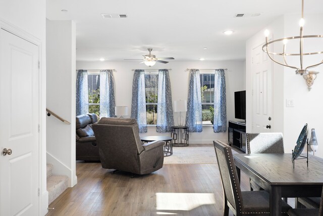 living room with ceiling fan and hardwood / wood-style floors