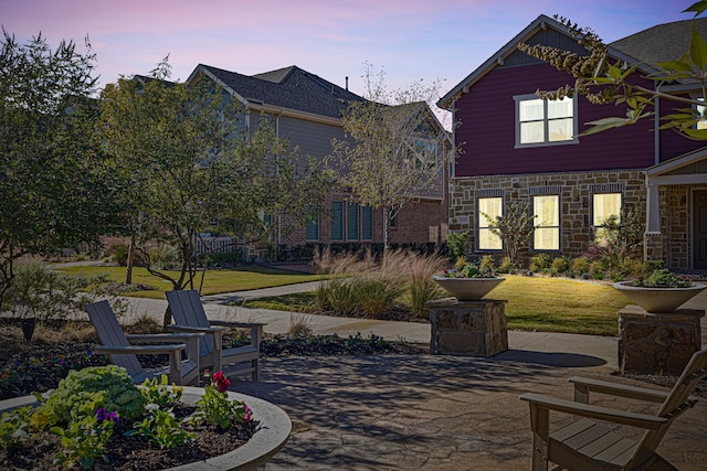 exterior space with a patio area and a yard