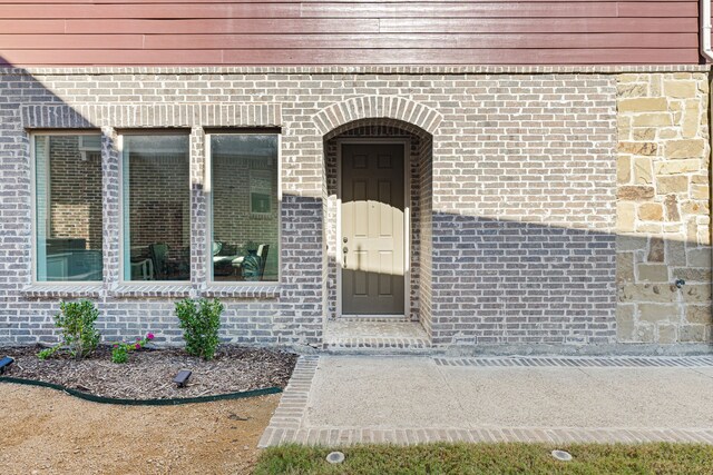 view of property exterior featuring a garage and central AC unit