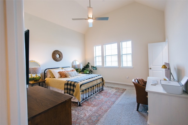 bedroom with ceiling fan, carpet, and high vaulted ceiling