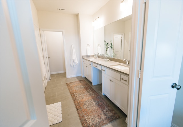 bathroom featuring tile patterned floors and vanity