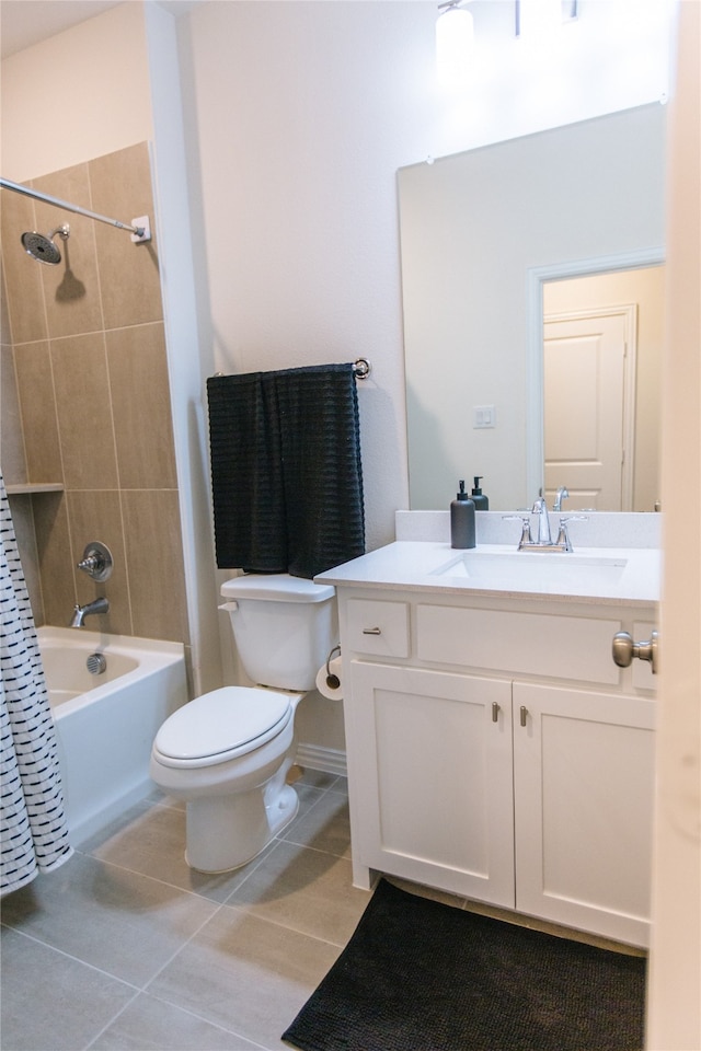 full bathroom featuring toilet, vanity, tile patterned floors, and shower / bath combo with shower curtain