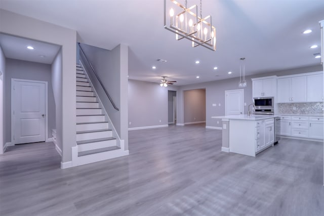 spare room featuring dark hardwood / wood-style flooring and ceiling fan