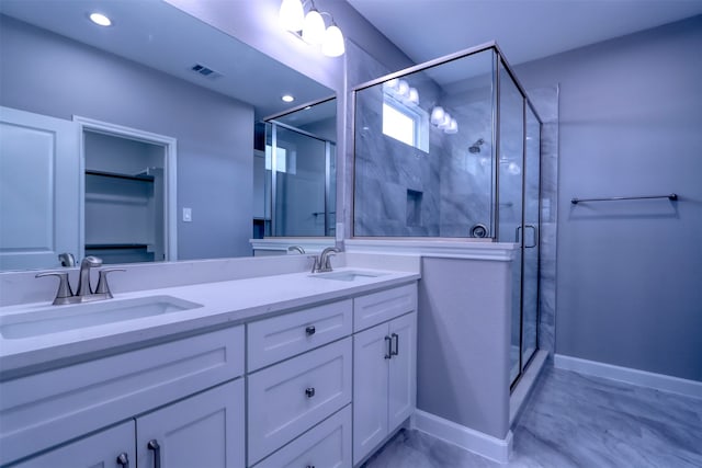 bathroom with vanity and an enclosed shower