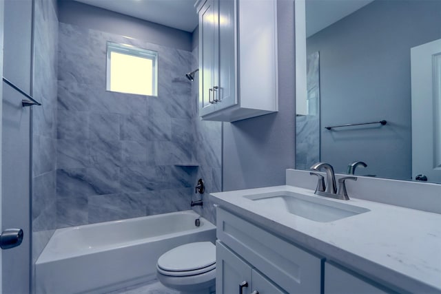 bathroom featuring toilet, vanity, and  shower combination