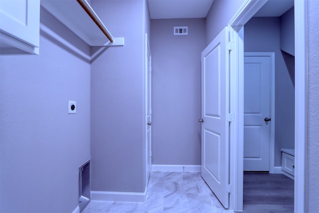 clothes washing area featuring washer hookup, electric dryer hookup, gas dryer hookup, and cabinets