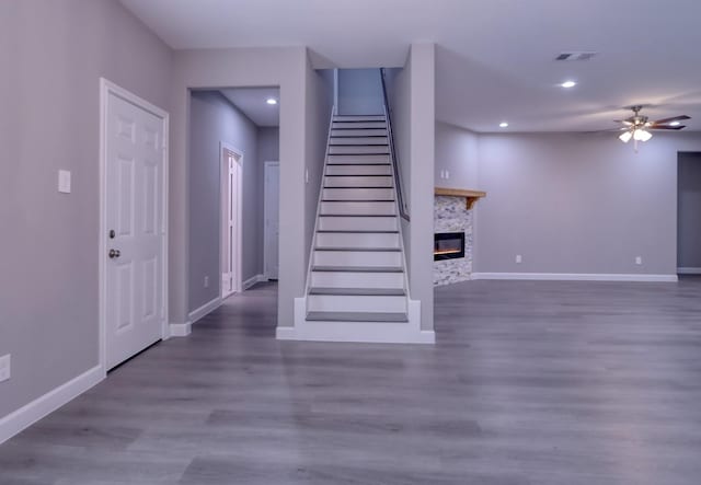 interior space featuring baseboards, wood finished floors, visible vents, and ceiling fan