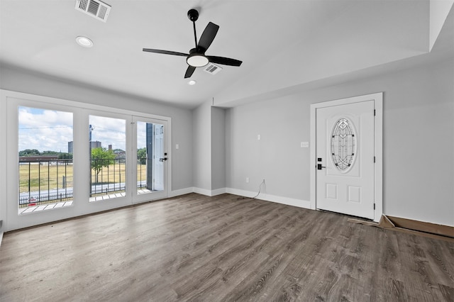 interior space featuring hardwood / wood-style floors, ceiling fan, and lofted ceiling