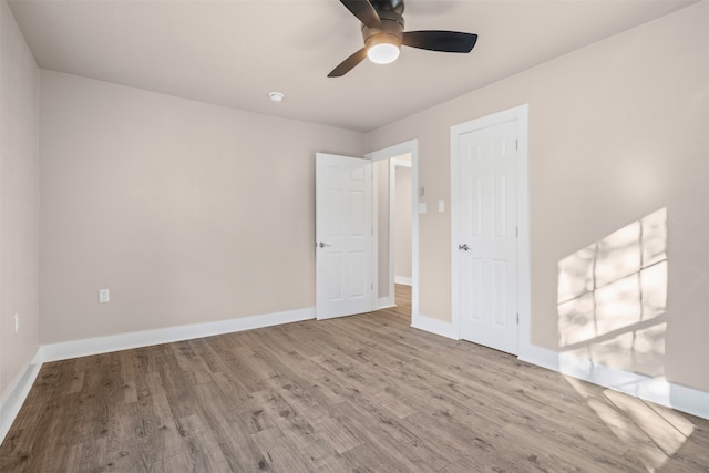 unfurnished room featuring ceiling fan and light hardwood / wood-style floors