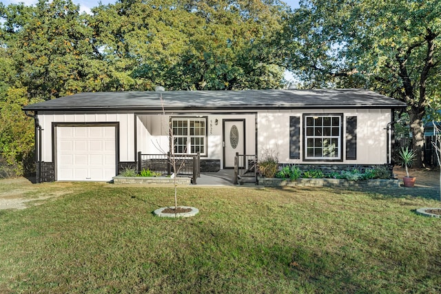 ranch-style home with covered porch, a garage, and a front lawn