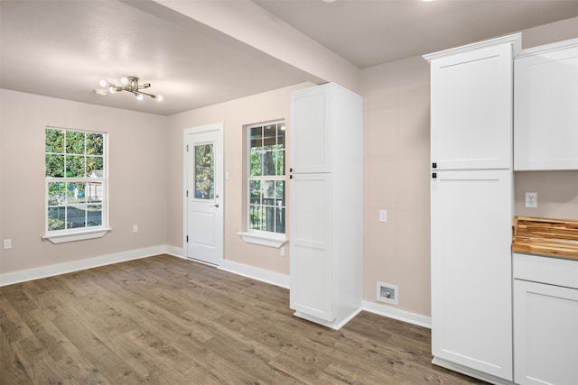 interior space with hardwood / wood-style floors and a chandelier