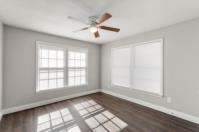 unfurnished room with dark hardwood / wood-style floors and ceiling fan