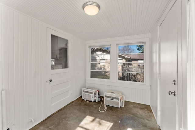 sunroom / solarium with a wall unit AC