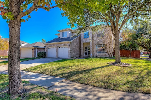 view of front of house with a garage and a front lawn