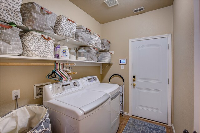 laundry area featuring washer and clothes dryer