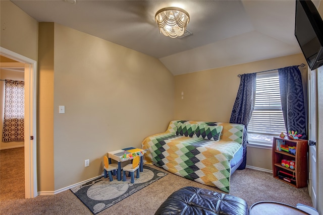 carpeted bedroom featuring lofted ceiling