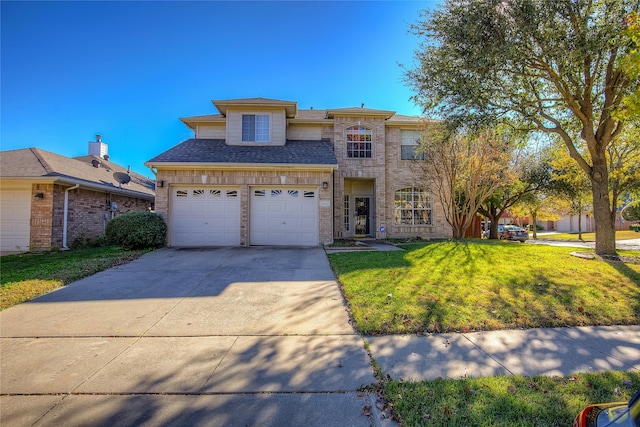 view of front of home with a front lawn and a garage