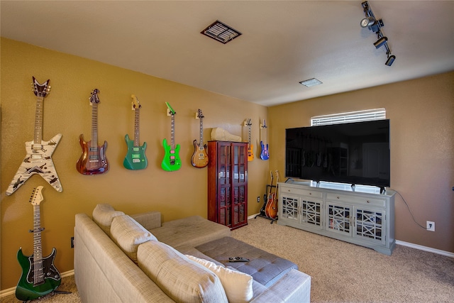 living room featuring carpet and track lighting