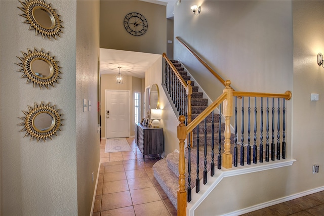 stairs with tile patterned floors