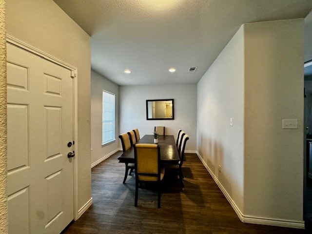 dining area featuring dark hardwood / wood-style floors