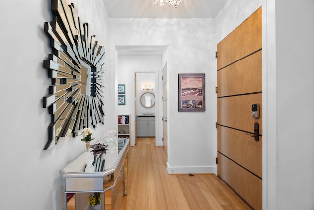 hallway with light hardwood / wood-style flooring