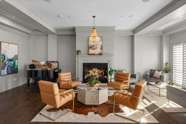 sitting room with crown molding and dark hardwood / wood-style flooring