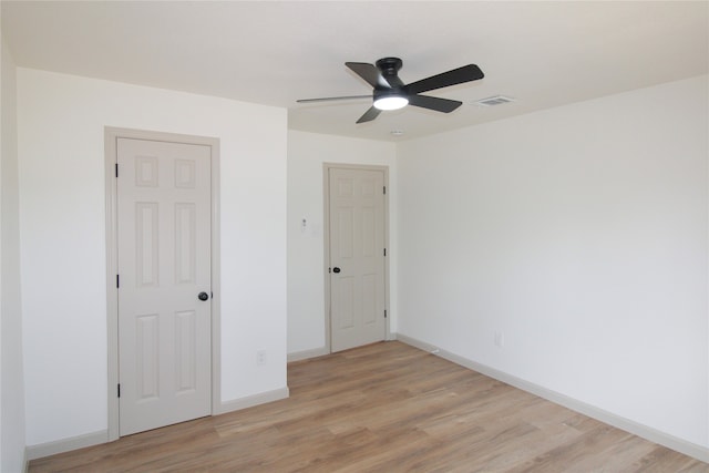 unfurnished room with light hardwood / wood-style flooring and ceiling fan