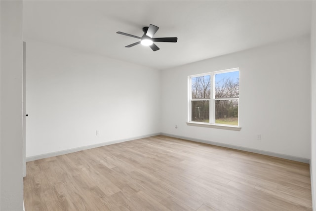 spare room featuring ceiling fan and light wood-type flooring