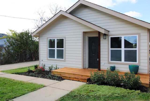 bungalow-style home featuring a deck