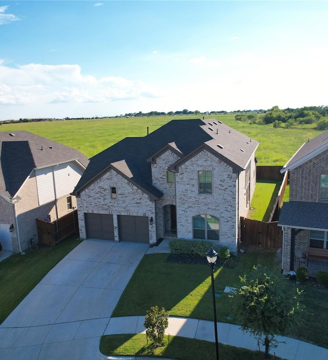 view of front of home featuring a garage and a front yard