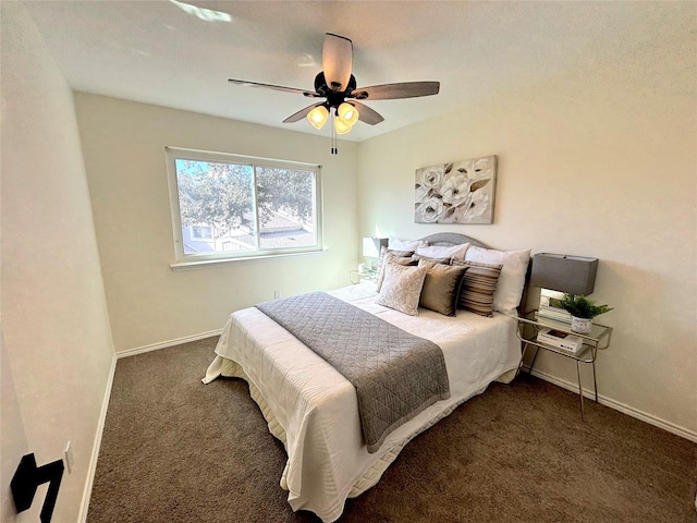 bedroom featuring dark colored carpet and ceiling fan