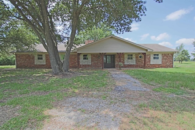 ranch-style home with a front yard