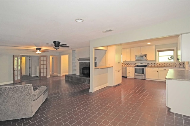 living room with ceiling fan