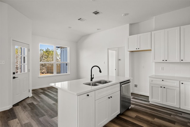 kitchen with white cabinets, dishwasher, sink, and a kitchen island with sink